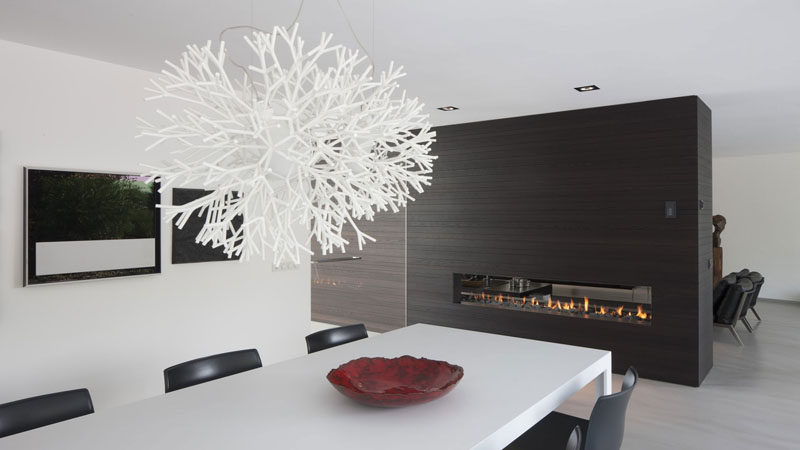 8 Lighting Ideas For Above Your Dining Table // Sculptural -- Using light fixtures made from unique materials or with an unusual design adds both light and art to your dining area.