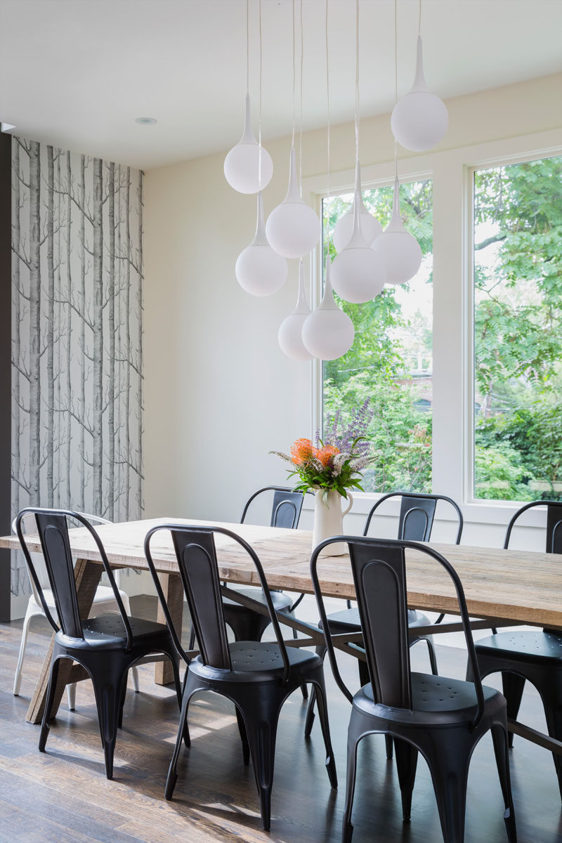 glass pendant lights over dining table