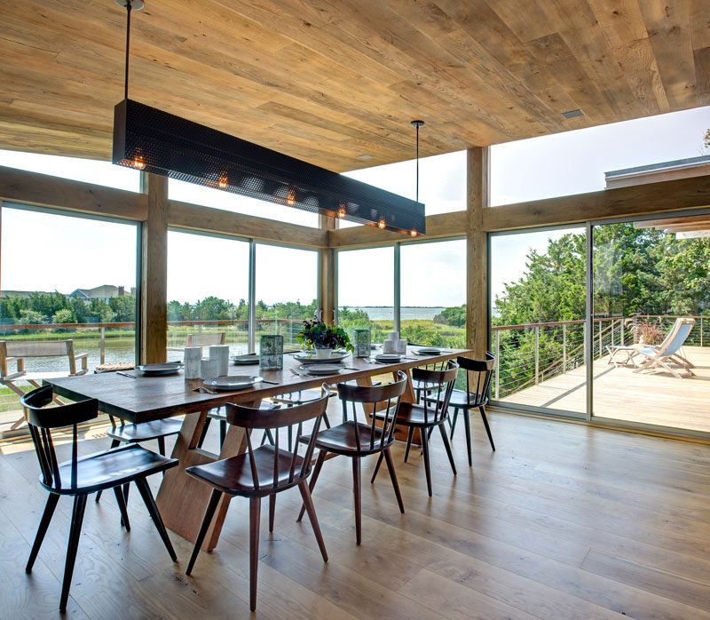 8 Lighting Ideas For Above Your Dining Table // Horizontal Rectangular Box Pendant -- This type of lighting is a great option for long tables that can seat many people. The long design of the light fixture means it can run the length of the table and provides everyone with ample lighting throughout the meal.