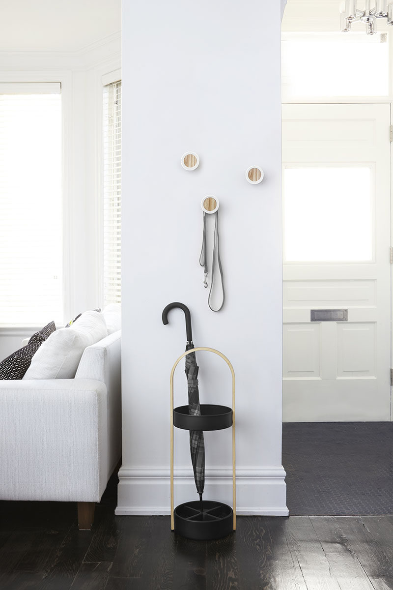 Interior Design Idea - What To Include When Creating The Ultimate Entryway // Umbrella Stand -- Rather than hanging your umbrella on a hook on the wall, where the water trickles down the wall, or just on the floor where you will have a puddle of water - add a simple umbrella stand to your entryway.