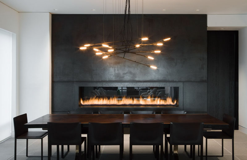 Fireplace Design Idea - 6 Different Materials To Use For A Fireplace Surround // This black steel fireplace surround gives a modern, industrial feel to a room. #FireplaceSurround #FireplaceIdeas #SteelFireplaceSurround
