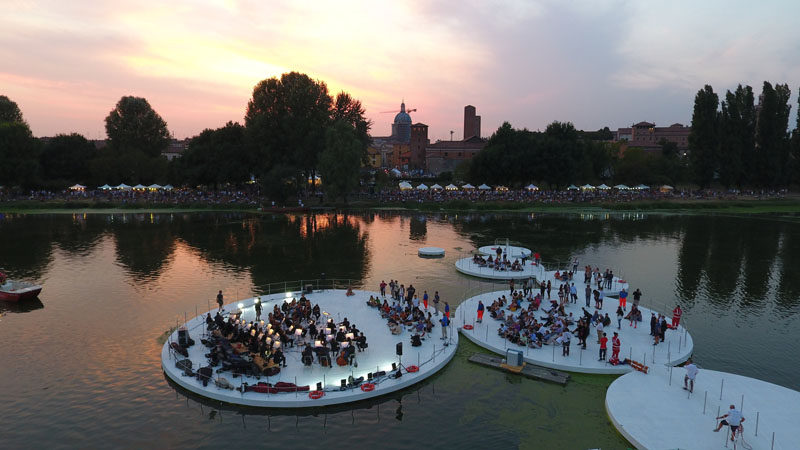 Floating islands, inspired by the lotus plant, have become a performance space on a lake in Italy.