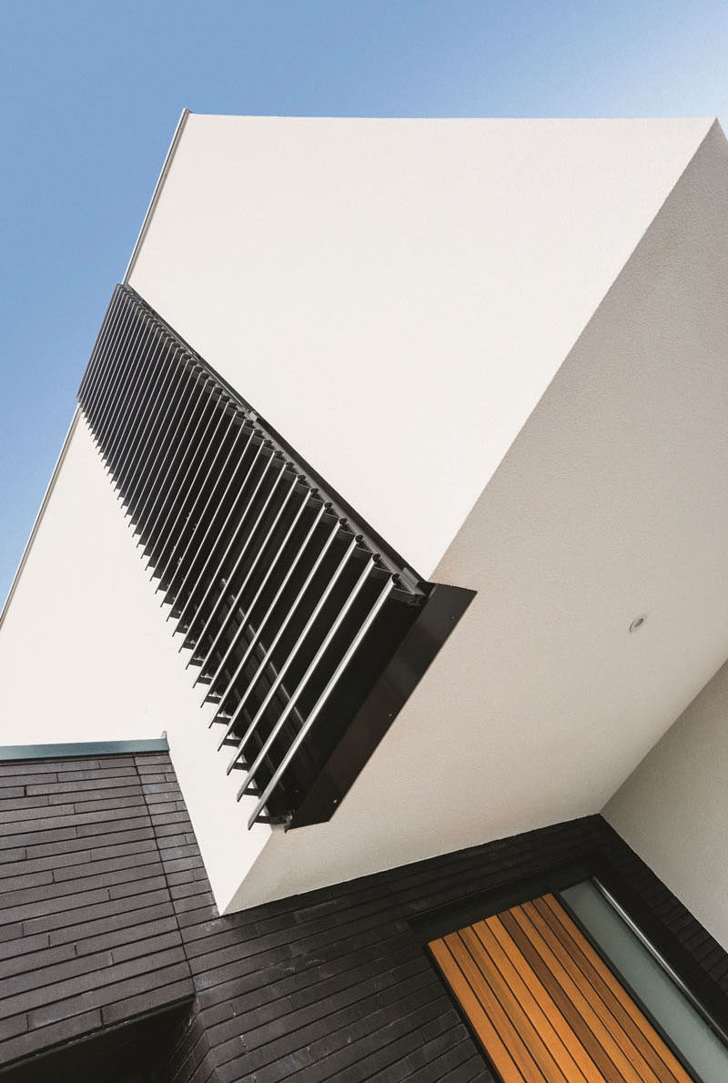 These window shutters open vertically instead of horizontally and provide a shade from the sun, and protection from intruders and the wind.