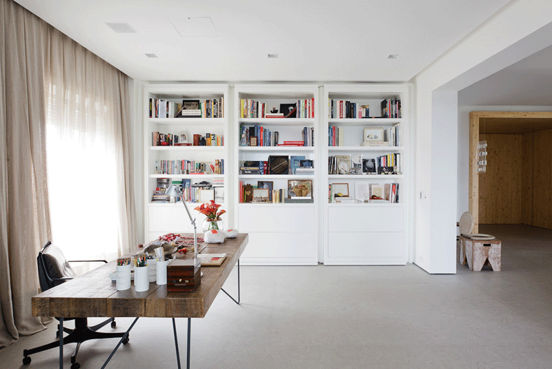 These built-in bookshelves double as hidden doors and open to reveal a secret living room.