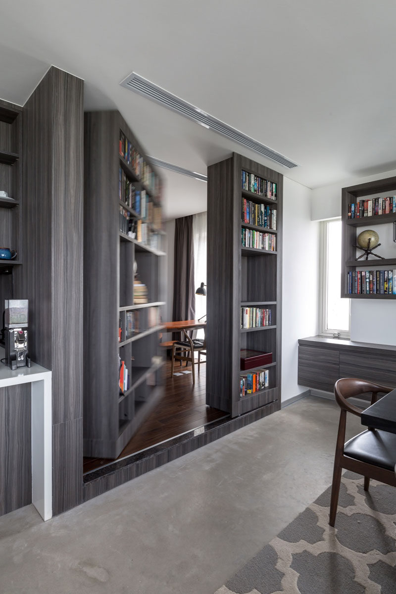 A secret guest bedroom/home office is hidden behind a bookshelf in this home.
