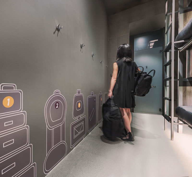 Wall graphics help guests to know where to put their luggage in this hostel.