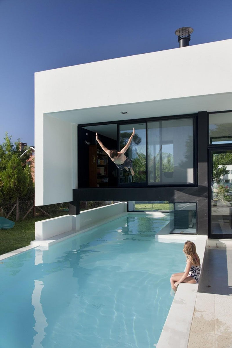 This swimming pool travels underneath a family house in Buenos Aires, Argentina.