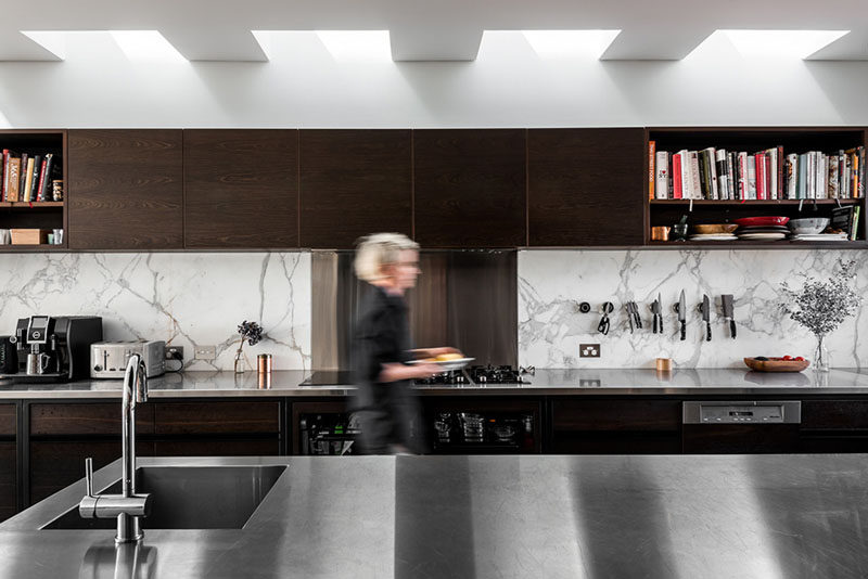 KITCHEN DESIGN IDEA - 7 Kitchen Sinks Integrated Into The Countertop // The seamless integration of this stainless steel sink allows crumbs and food waste to be easily swept from the workspace right into it.