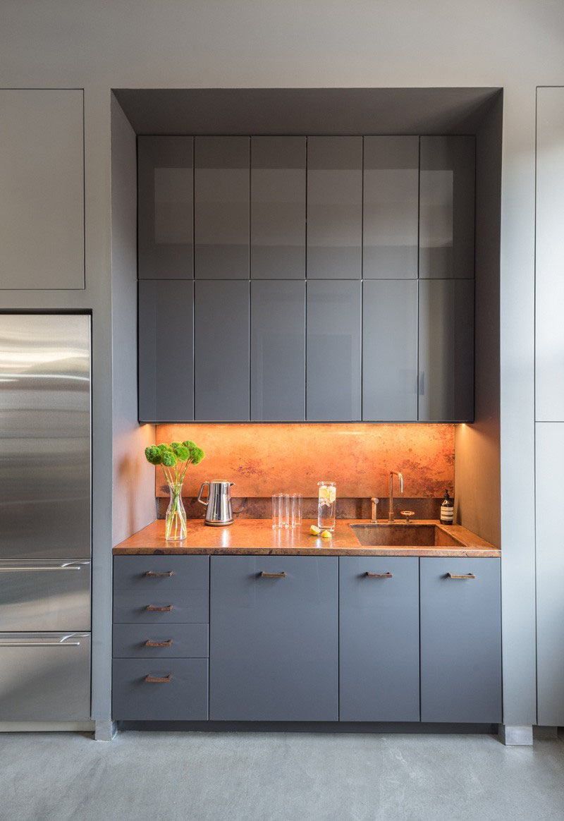 KITCHEN DESIGN IDEA - 7 Kitchen Sinks Integrated Into The Countertop // Integrated sinks aren't just for big kitchens. This mini kitchen has a seamless sink, too, making spills easier to clean up.