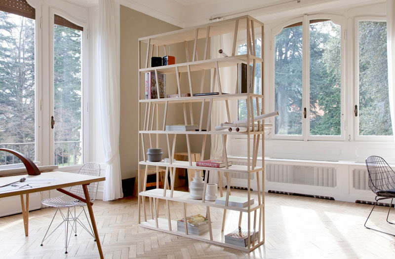 Room Divider Ideas - 10 Examples Of Multi-Functional Room Dividers // This simple two-in-one room dividing bookshelf is great for tiny apartments or in spaces where a full dividing wall isn't necessary.