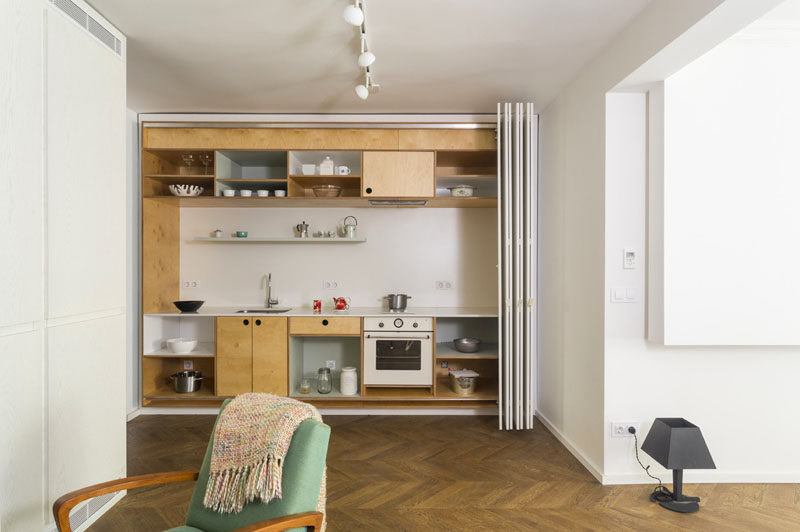 Kitchen Design Idea - Open Shelving (19 Photos) // This tiny kitchen features both open and closed shelving on the top and bottom parts of the kitchen, creating the ability to display the beautiful and hide the not-so-beautiful.