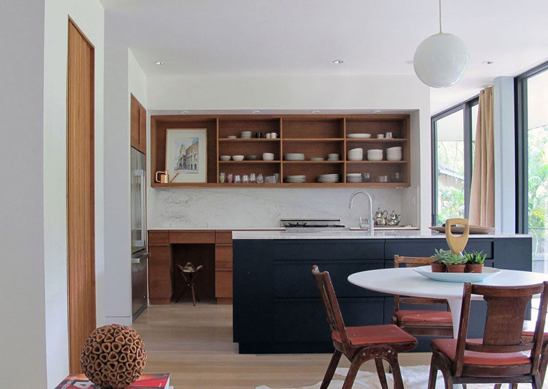 Kitchen Design Idea - Open Shelving (19 Photos) // Open shelving along the top part of this kitchen keeps the simple plates and bowls on display and makes them easily accessible.