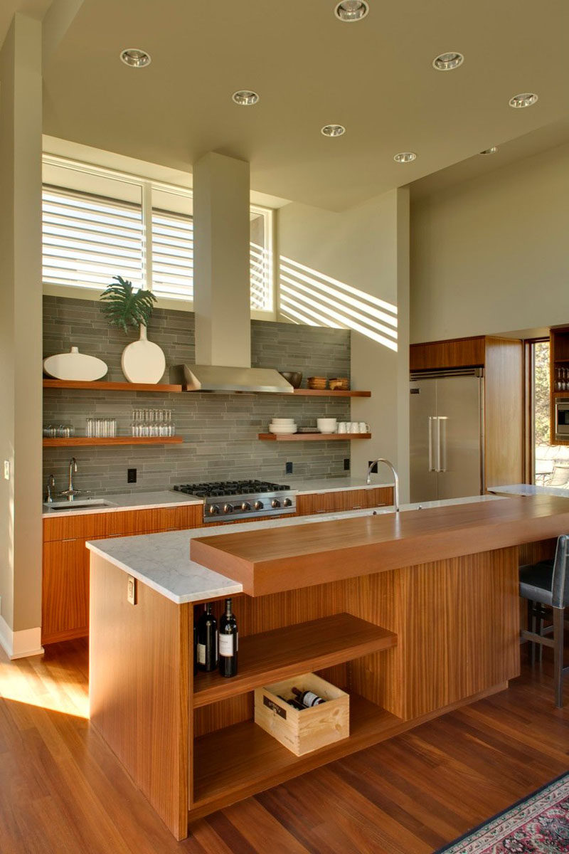 Kitchen Design Idea - Open Shelving (19 Photos) // Open shelves on either side of the stove keep essentials at hand, while open shelving in the island keeps the wine on display but out of the way.