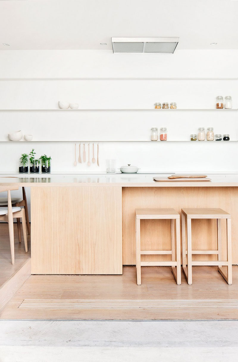 Kitchen Design Idea - Open Shelving (19 Photos) // Long white open shelves almost appear to blend into the background, and create tons of space for storing bowls, utensils, and food.