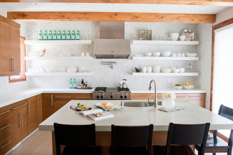 Kitchen Design Idea - Open Shelving (19 Photos) // This kitchen has a mix of both open and closed shelving in the kitchen but keeps the pretty things on display and makes sure that the sparkling water supply is always full.