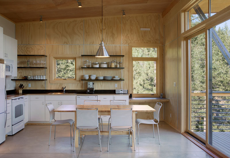 Kitchen Design Idea - Open Shelving (19 Photos) // Dark wood shelves against the light wood walls make a statement but are kept from feeling overpowering by the lack of cupboard doors.