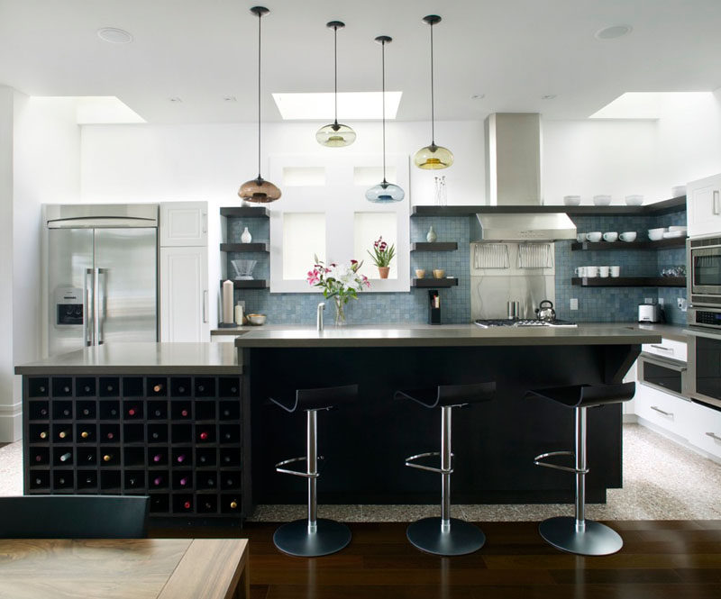 Kitchen Design Idea - Open Shelving (19 Photos) // Dark wood shelves in this kitchen match the other dark elements through but, because they keep much of the tile backsplash visible, allow the space to maintain a bright and airy feel.