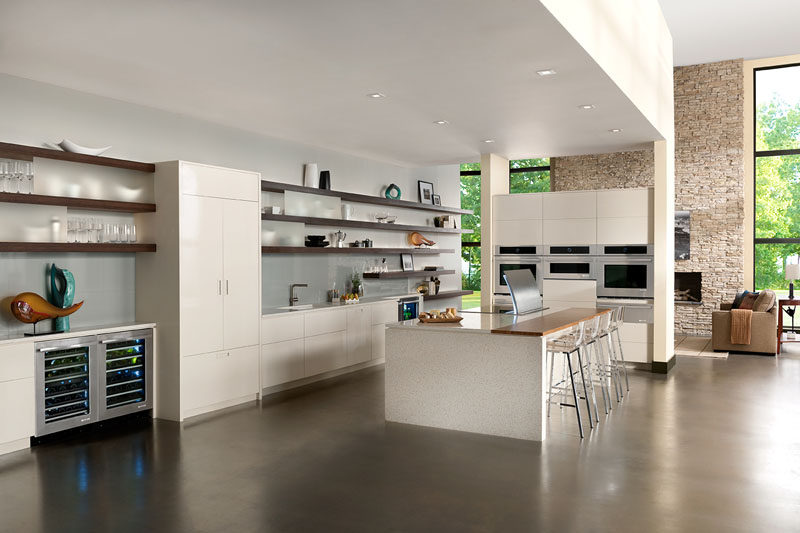 Kitchen Design Idea - Open Shelving (19 Photos) // Long open shelves are broken up with pieces of frosted glass to keep the less beautiful pieces slightly out of focus.