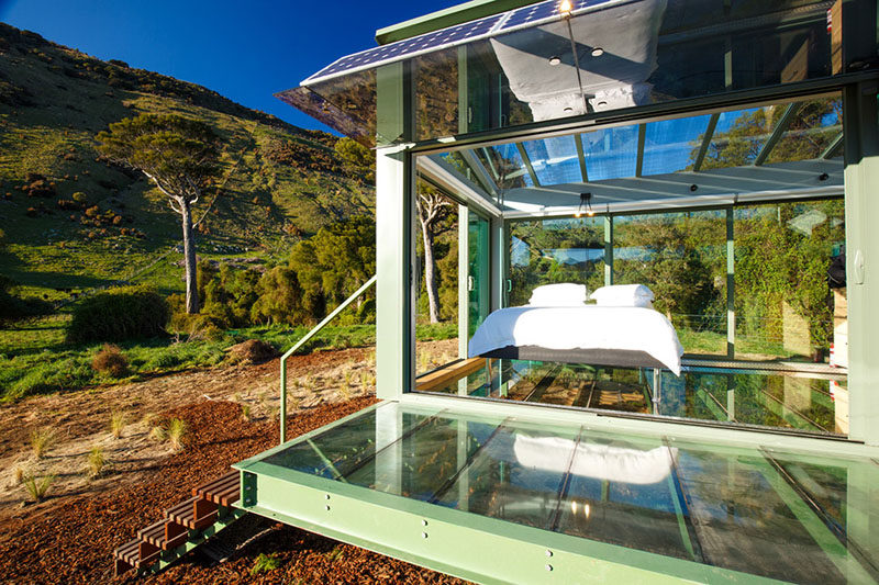 You can hike to and stay in a secluded glass hotel room in the middle of a valley in New Zealand.