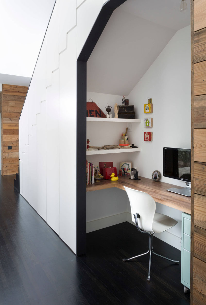 10 Small Home Office Ideas - This desk tucked under the stairs features a wrap around desk, two wall mounted shelves, and a small filing cabinet - all the essentials you need for a functional home office. #HomeOffice #SmallHomeOffice #SmallDesk #InteriorDesign