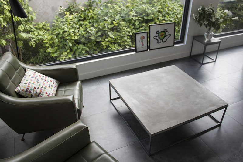 10 Examples Of Concrete and Steel Tables To Add To Your Industrial Interior // A simple minimalist square table lets the steel and concrete do all the talking.