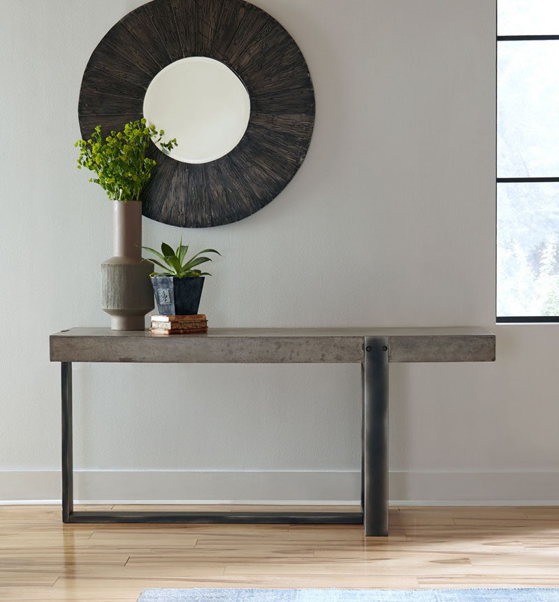 10 Examples Of Concrete and Steel Tables To Add To Your Industrial Interior // The unique design of the legs of this table adds a sculptural element to it and turns it into an artistic detail.