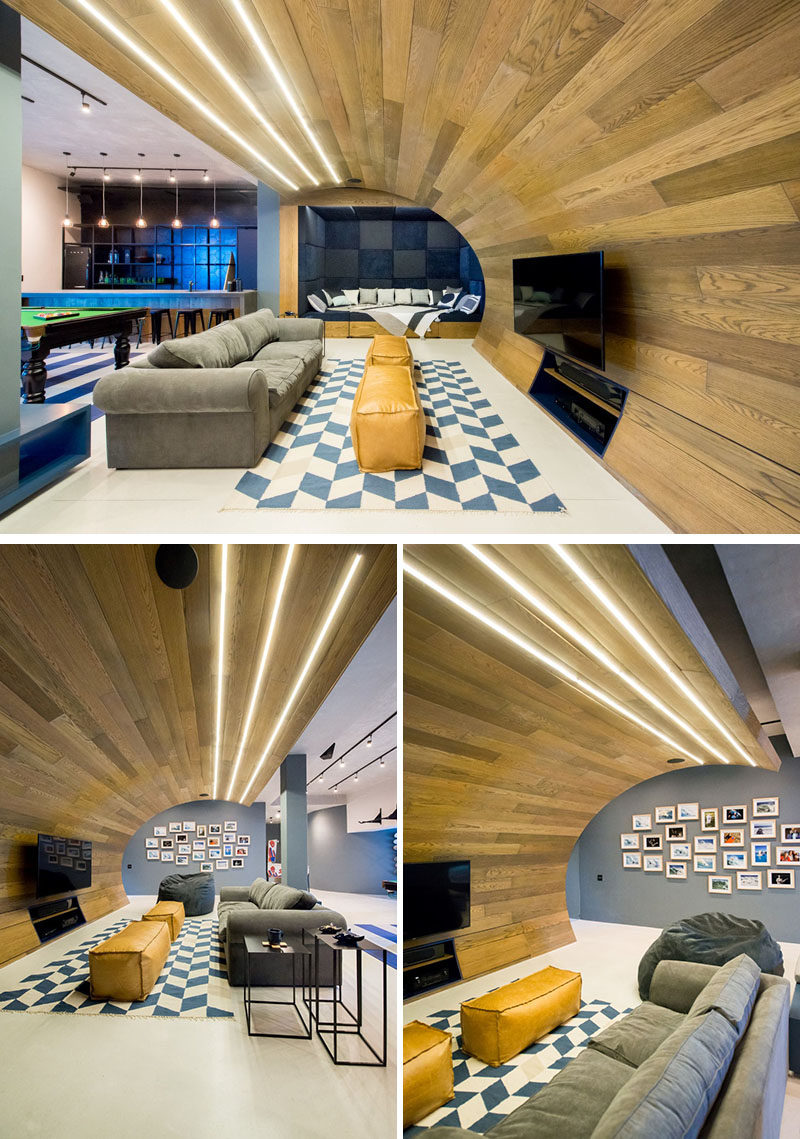 This basement designed for a teenager features a wooden wave, a bar/snack area, a skate bowl, arcade games and a workout area.