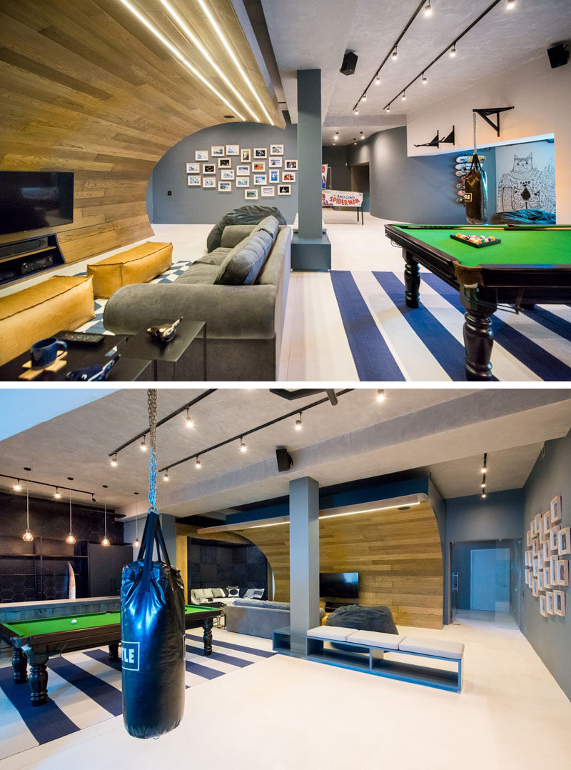 This basement designed for a teenager features a wooden wave, a bar/snack area, a skate bowl, arcade games and a workout area.