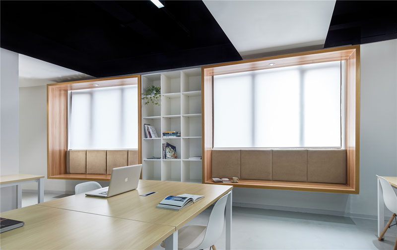 Modern Window Seat Idea - Add a suspended wood surround to standard windows to create an activated space. #ModernWindowSeat #WoodLinedWindowSeat #WorkplaceDesign #OfficeDesign