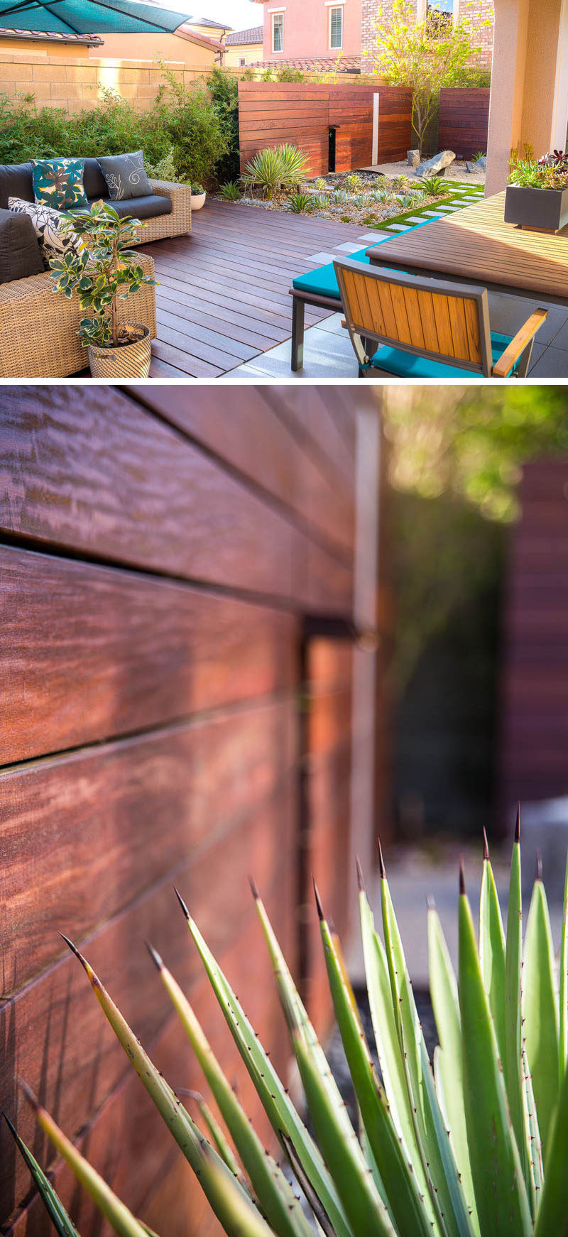 Including wood in your zen garden design helps to give the space a more natural feel. A wood privacy screen and a wood deck, like in this garden, warm up the environment and make it feel more calming while also providing you with privacy and an entertainment space. #ZenGarden #RockGarden #GardenIdeas #PatioIdeas #Landscaping #LandscapeIdeas #LowMaintenanceGarden