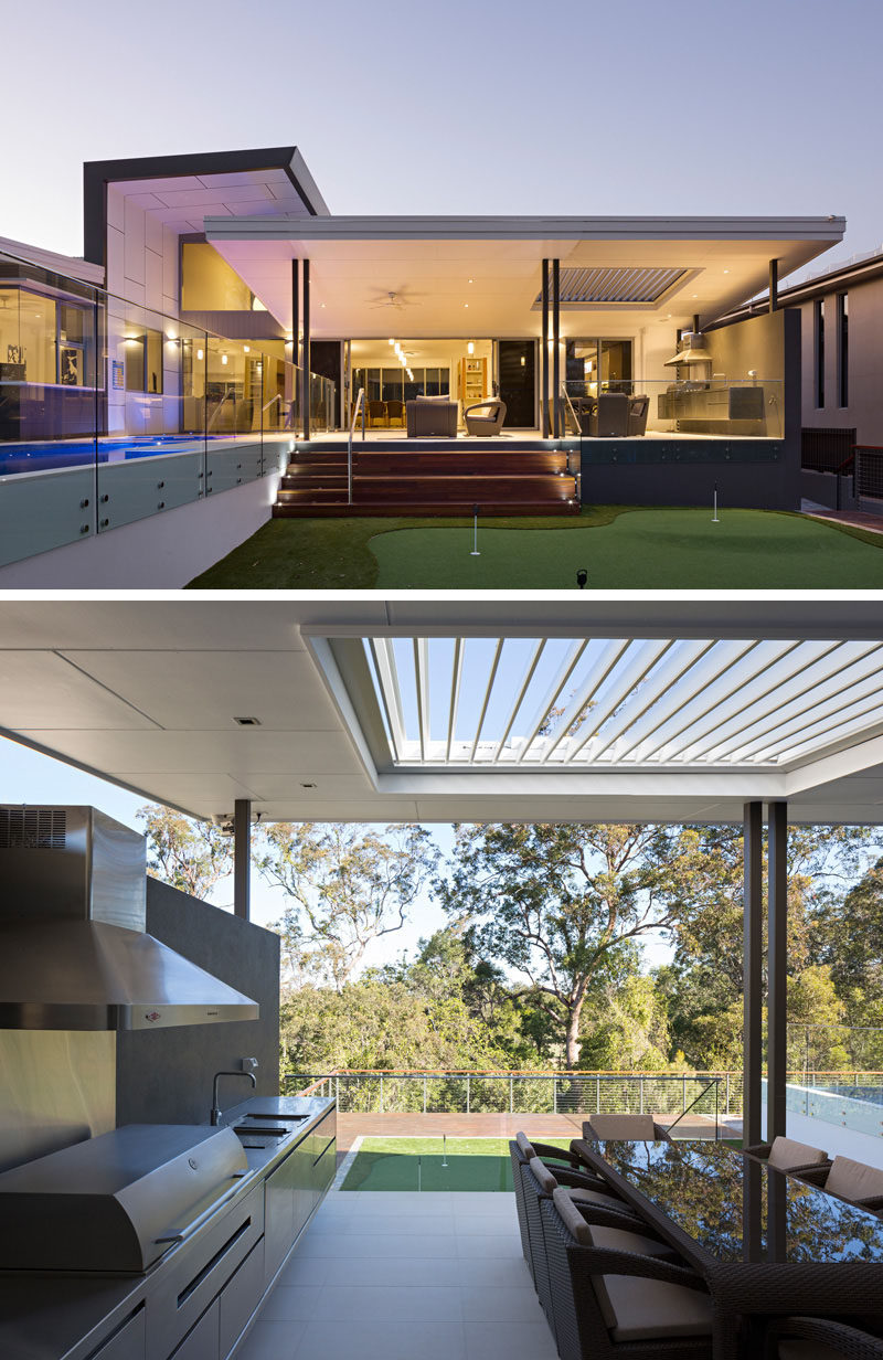 23 Awesome Australian Homes That Perfect Indoor / Outdoor Living // Glass doors connect the main level of this home to a covered outdoor dining and entertaining area, and lead out to the pool and putting green.