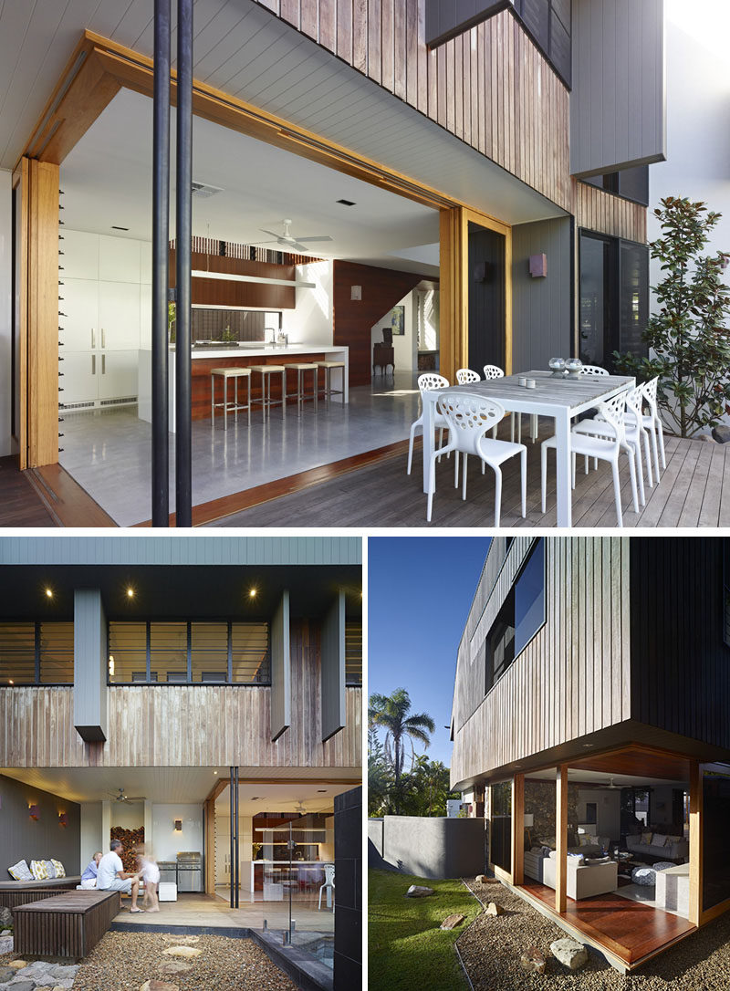 23 Awesome Australian Homes That Perfect Indoor / Outdoor Living // The kitchen of this home connects to a dining patio and entertaining area with a wood burning fireplace, barbeque, and built-in seating.