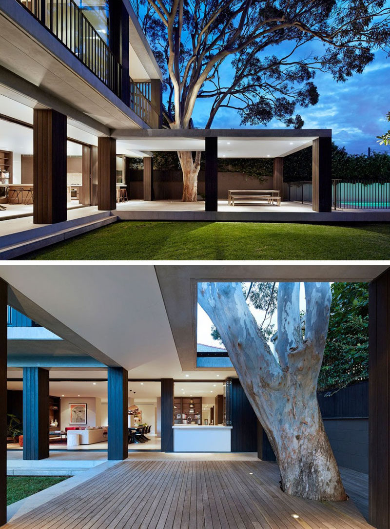 23 Awesome Australian Homes That Perfect Indoor / Outdoor Living // The bottom level of this home opens up onto a partially covered deck with integrated lighting and enough space to comfortably fit a dining table and barbeque, as well as prep space if necessary.