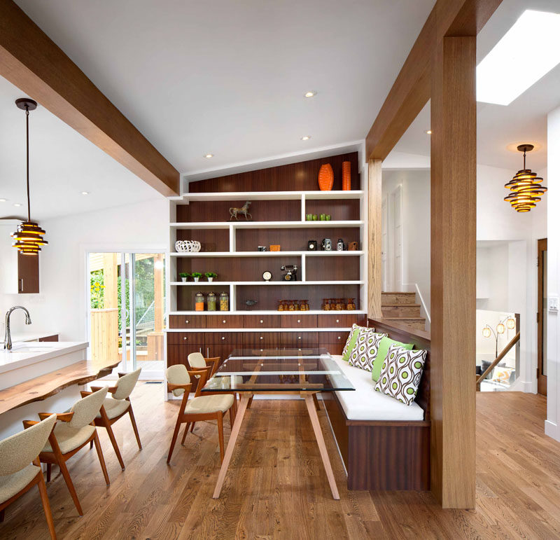 Dining Room Design Ideas - Use Built-In Banquette Seating To Save Space // A glass table top helps make this small built in banquette feel larger and accentuates the use of various types of wood throughout the kitchen.