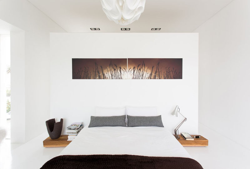 Bedroom Design Ideas - 8 Ways To Decorate The Wall Above Your Bed // Artwork - What better place to hang a favorite piece of art than above your bed. It'll fill the empty space and adds personality to your bedroom.