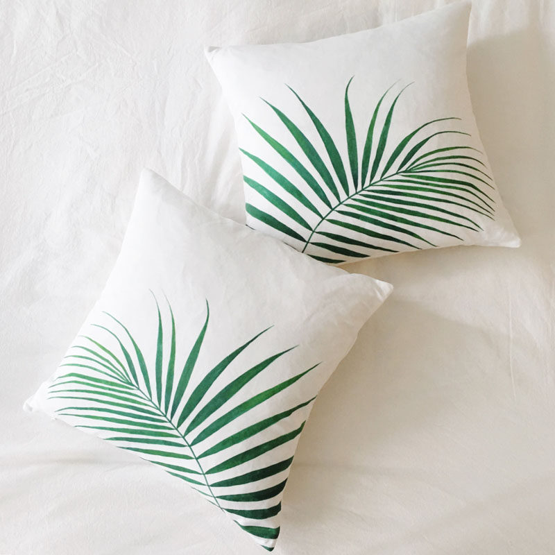 17 Ways To Introduce Botanical Designs Into Your Home Decor // These simple palm leaf pillows add a touch of the botanical trend to your couch and give you a comfy place to rest your head.