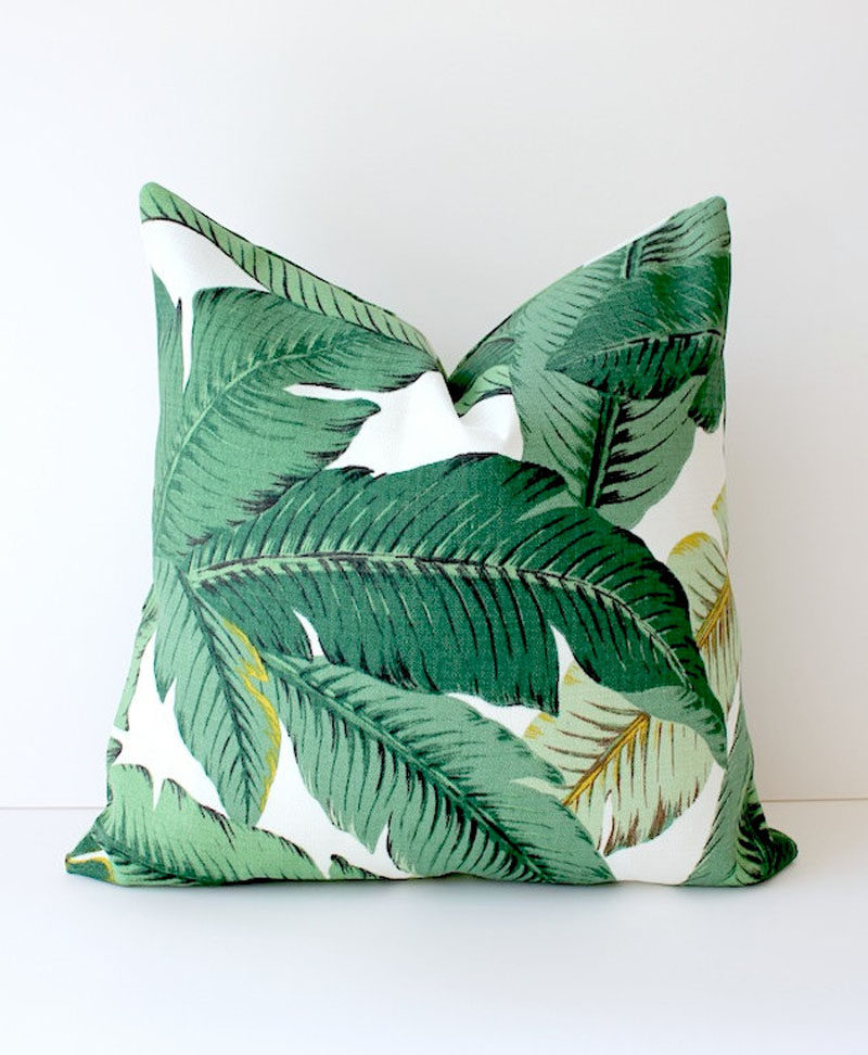 17 Ways To Introduce Botanical Designs Into Your Home Decor // Add a statement pillow to your couch collection with these tropical leaf pillows that bring color, comfort and botanicals into your home.