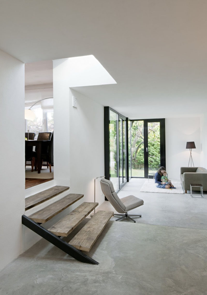 23 Pictures That Show How Concrete Floors Have been Used Throughout Homes // Concrete in the living room may sound cold and uninviting but if it's layered with blankets, pillows, and comfy cushions, the opposite ends up being true.
