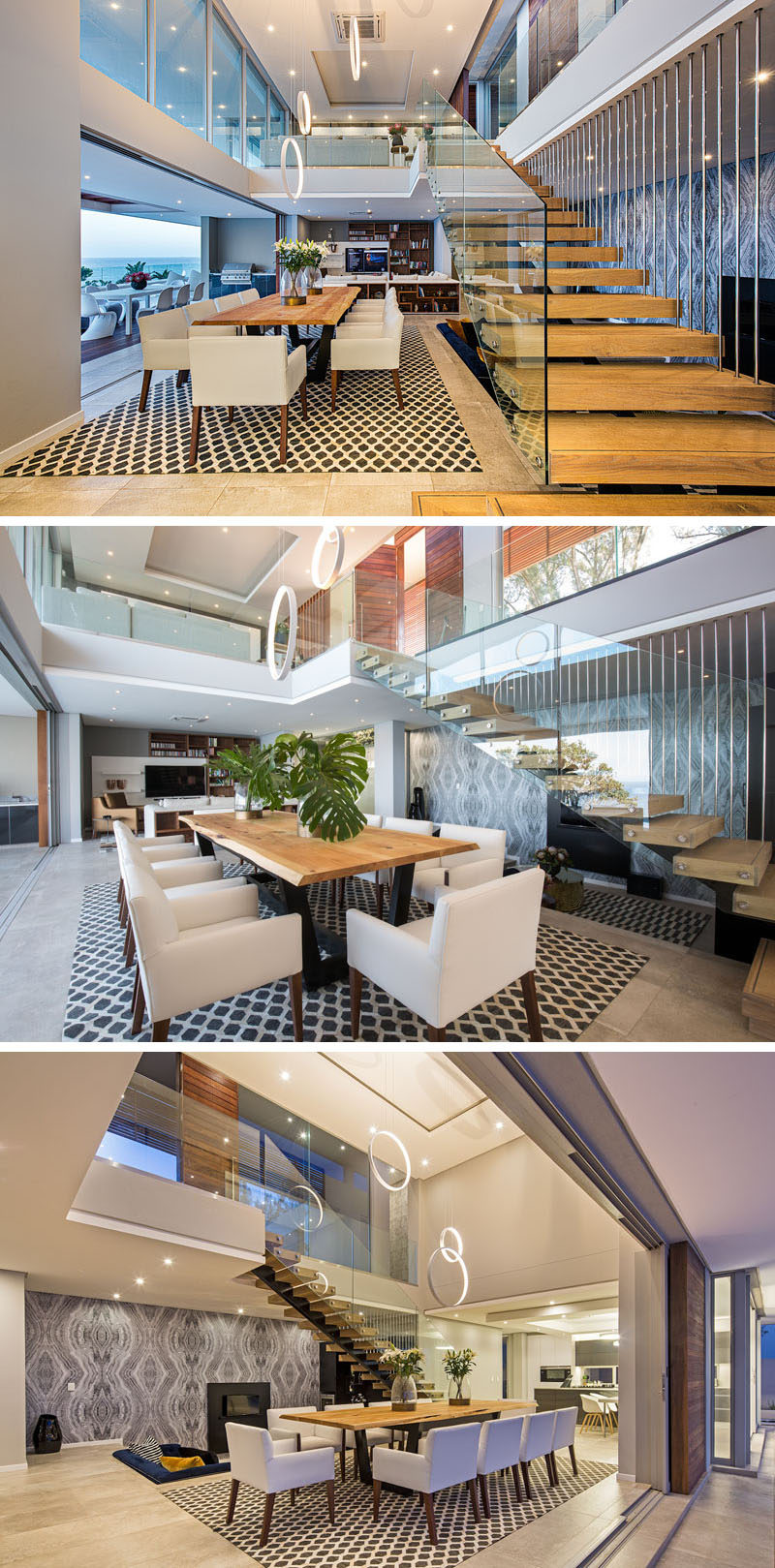 At the bottom of this solid oak and glass staircase is the dining room, with a large wooden table anchored in the space by an artistic rug.