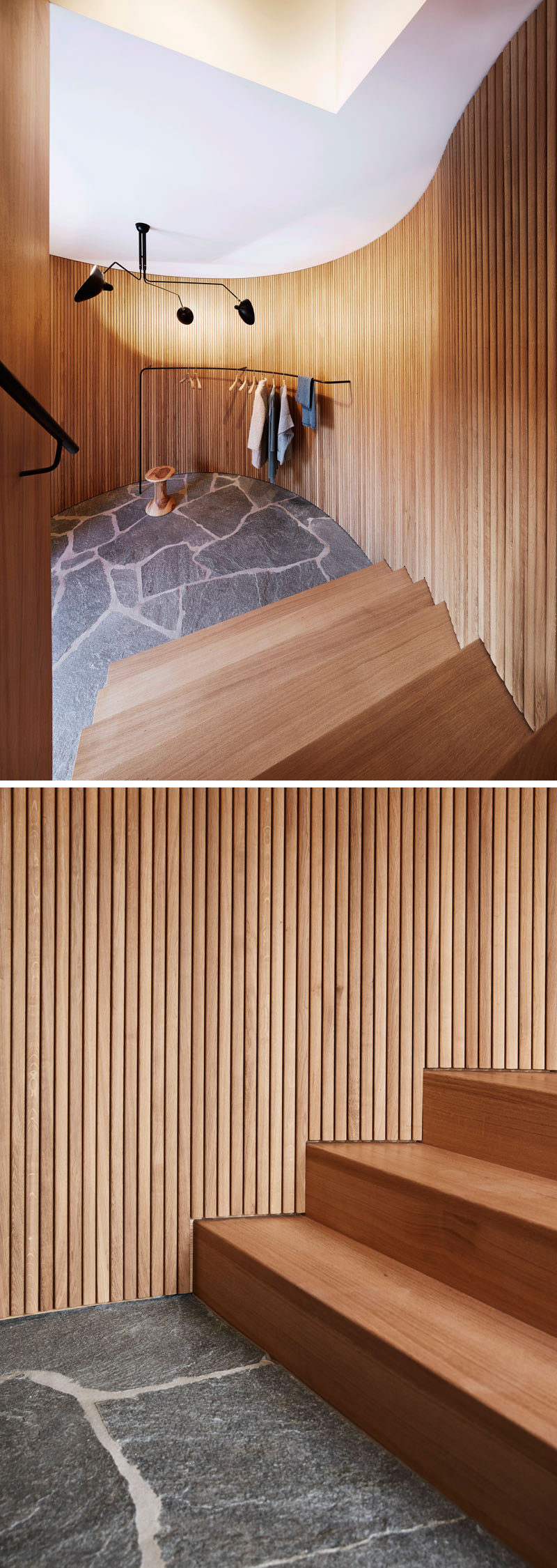 These stairs are surrounded by wooden slats that curve around and create a softer look for the space. At the bottom of the stairs, a simple rail provides a place to hang outerwear.