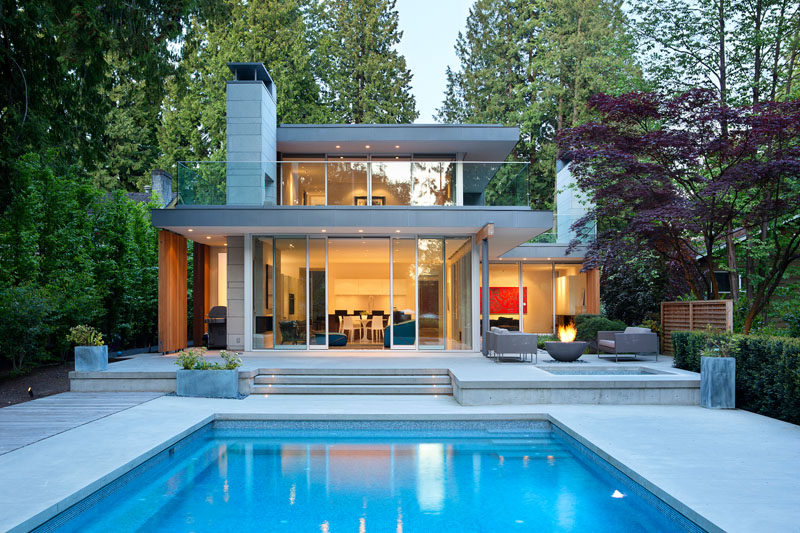 James K.M. Cheng Architects have designed this house in Vancouver, Canada, that is positioned on a lot 350 feet in length and is surrounded by mature evergreen trees and high garden hedges.