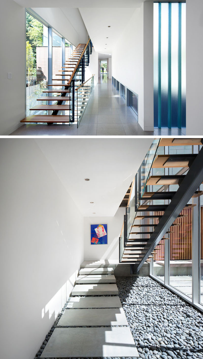 Wood and steel stairs pass by the windows and lead you to the various floors of this home.