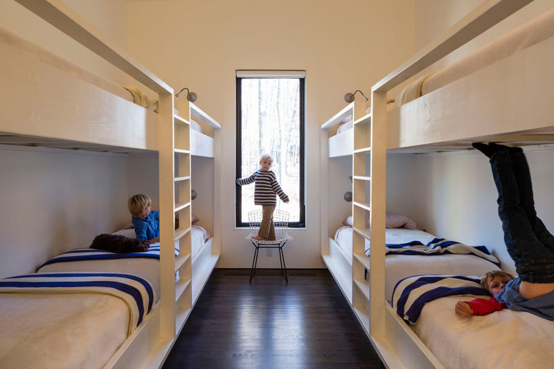 This kids bedroom at a house by the river has built-in bunk beds that can sleep eight.