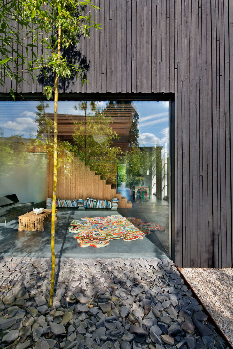 A large window in this renovated coach house provides plenty of light to the interior of the home.