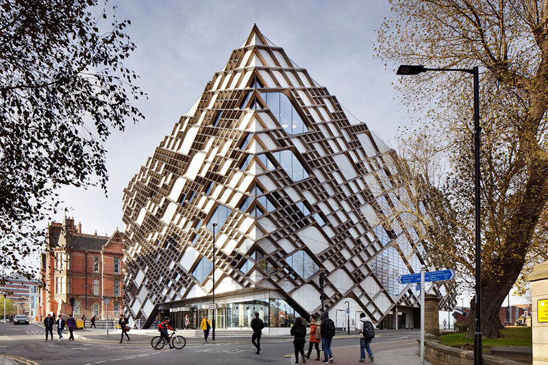 Exterior Design Ideas - 15 Buildings That Have Unique And Creative Facades // The facade of this university engineering building is made from anodized aluminum that was inspired by the detailed stone tracery of the neighboring church, and resembles a cellular structure commonly studied by students inside the building.