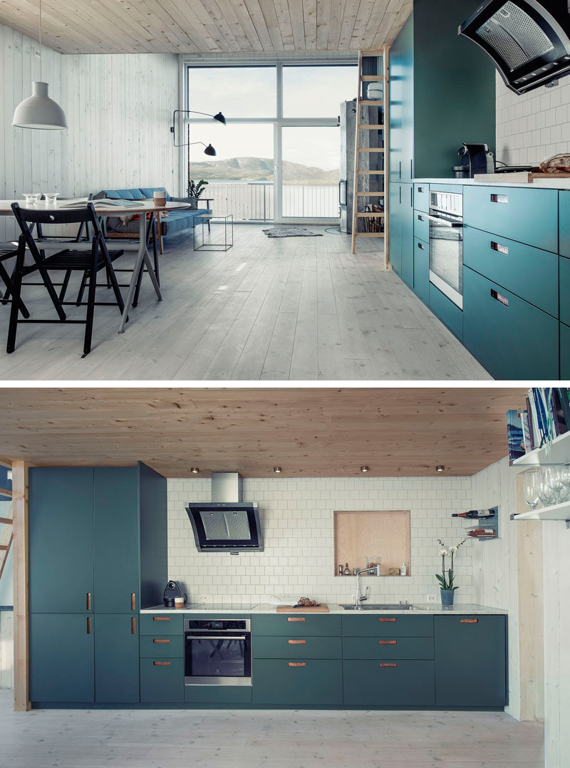 Kitchen Design Ideas - Deep Blue Kitchens // Dark teal cabinets bring color and fun into the light wood interior of this home.