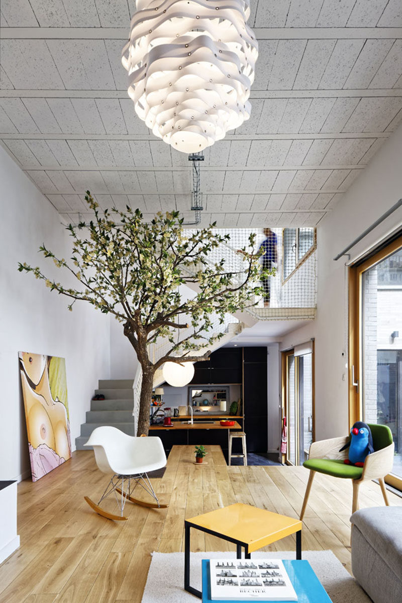 Interior Design Ideas - The floor of this living room extends and becomes a cantilevered dining table