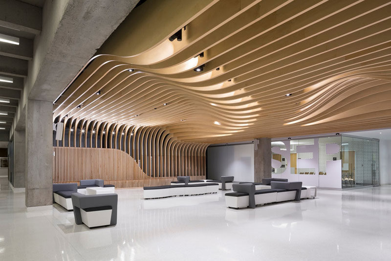The seat along the wall becomes a dramatic sculptural wood ceiling