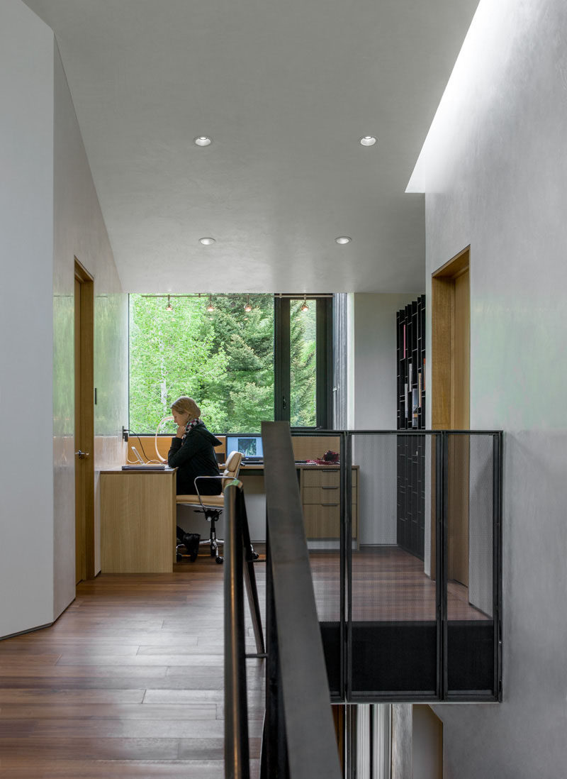 Interior Design Idea - 13 Examples Of Desks In Hallways // This home office sits at the top of the stairs in the hallway between two rooms.