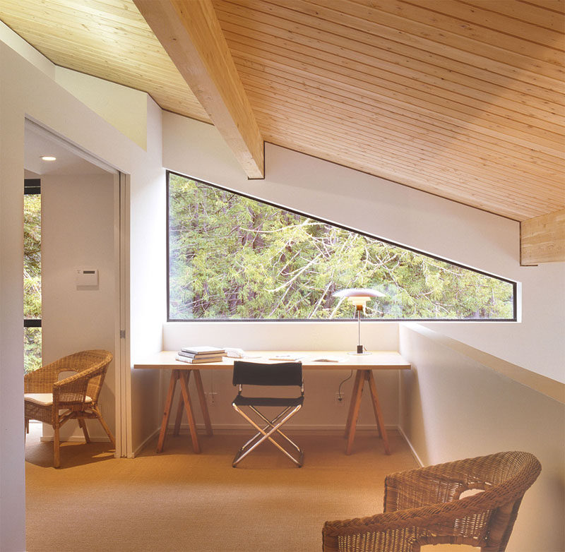 Interior Design Idea - 13 Examples Of Desks In Hallways // This desk has views of the forest outside and looks down to the room below, keeping it connected to what's going on in the rest of the house.